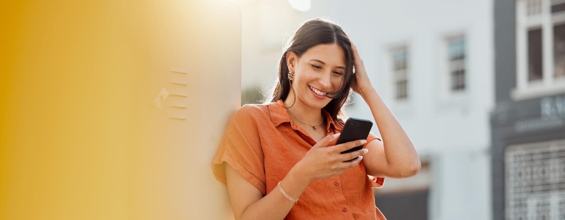 a woman holding a phone